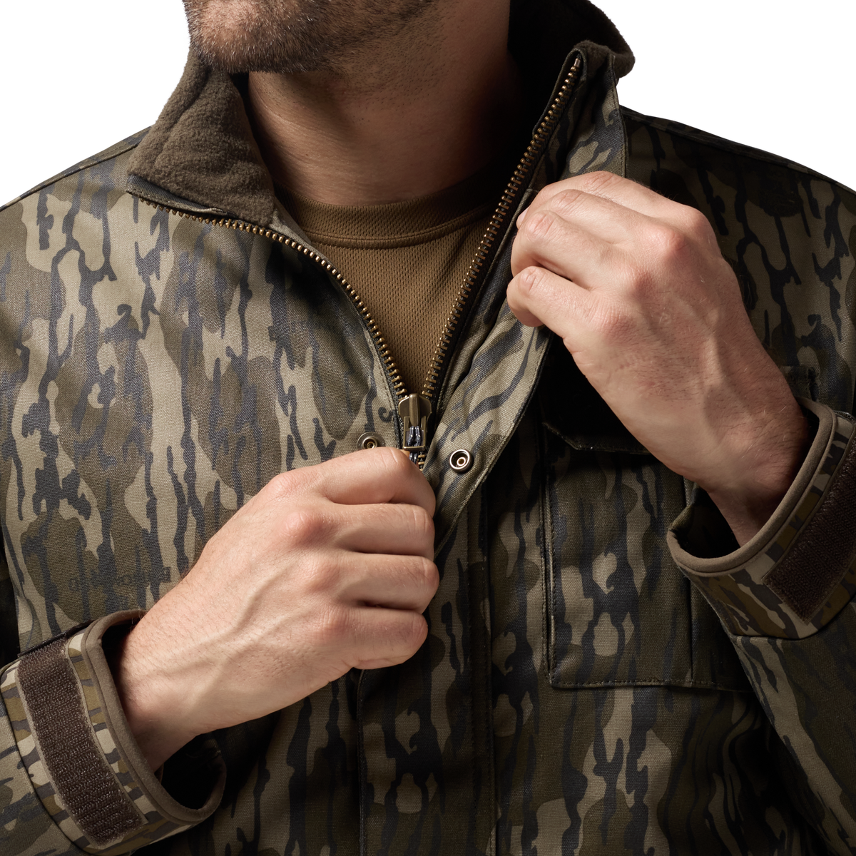 Waxed Canvas Goose Down Jacket in Mossy Oak Original Bottomland, on model #mossy_oak_original_bottomland