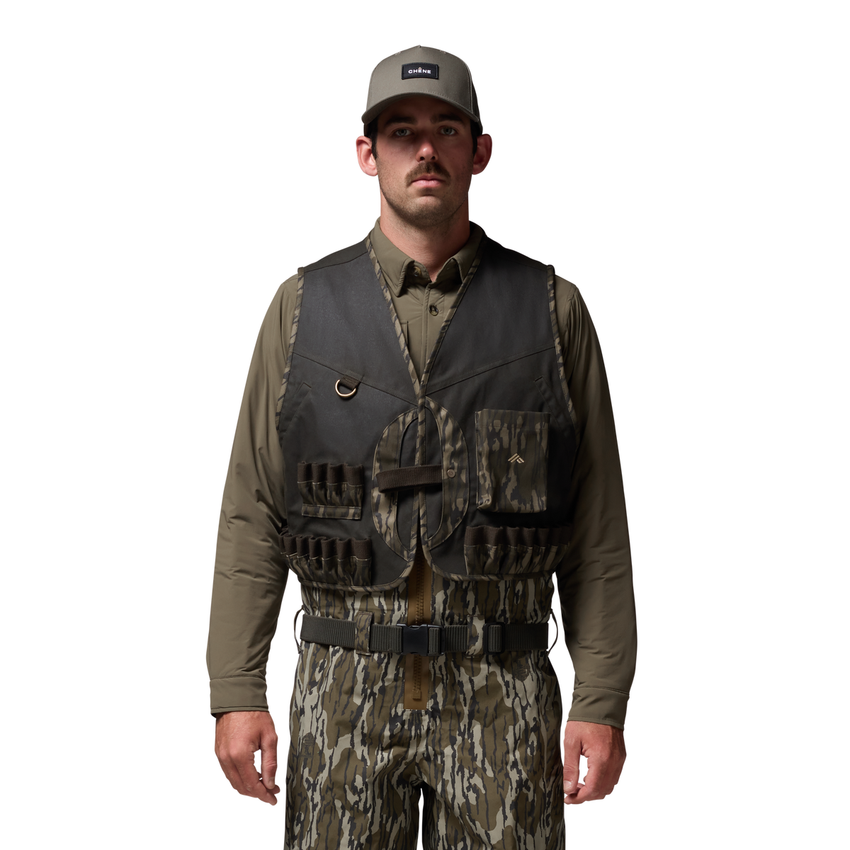 Waxed Canvas Wading Vest in Olive / Mossy Oak Original Bottomland, on model #olive_/_mossy_oak_original_bottomland