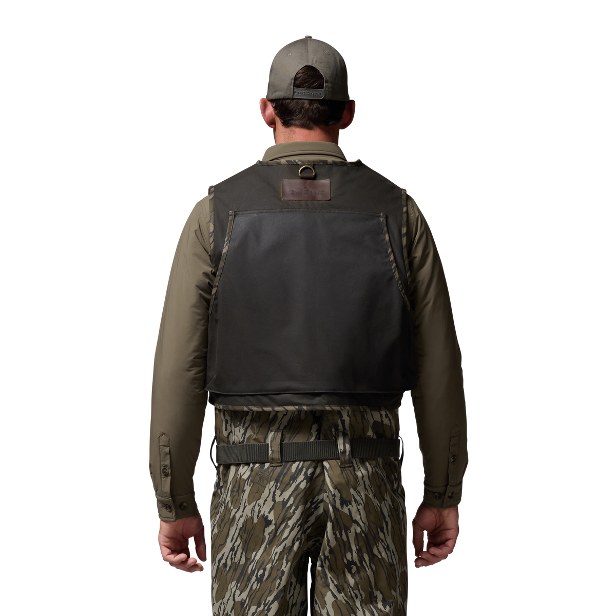 Waxed Canvas Wading Vest in Olive / Mossy Oak Original Bottomland, on model #olive_/_mossy_oak_original_bottomland