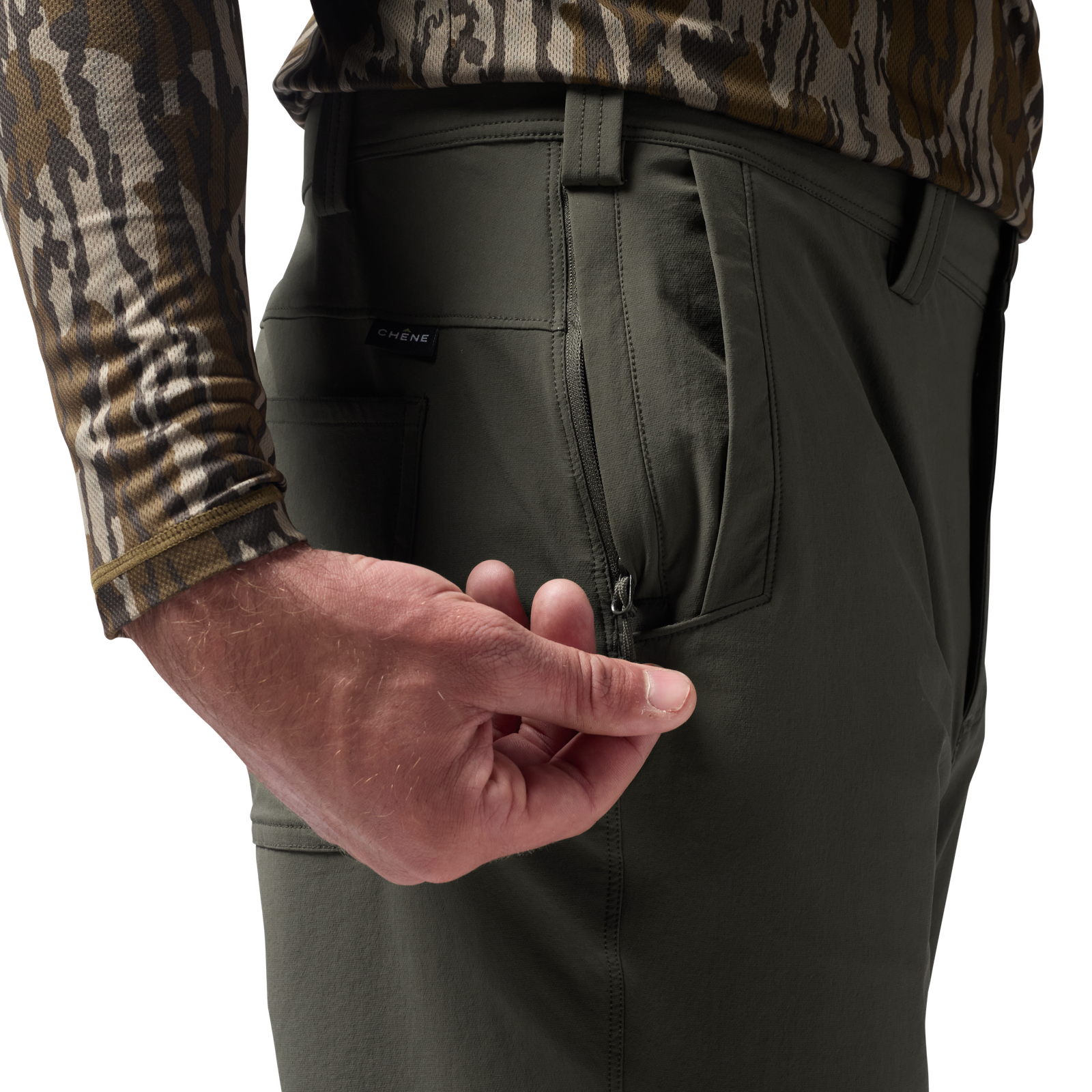 Person wearing dark green pants with a camouflage shirt, focusing on the pants' pocket. #cypress