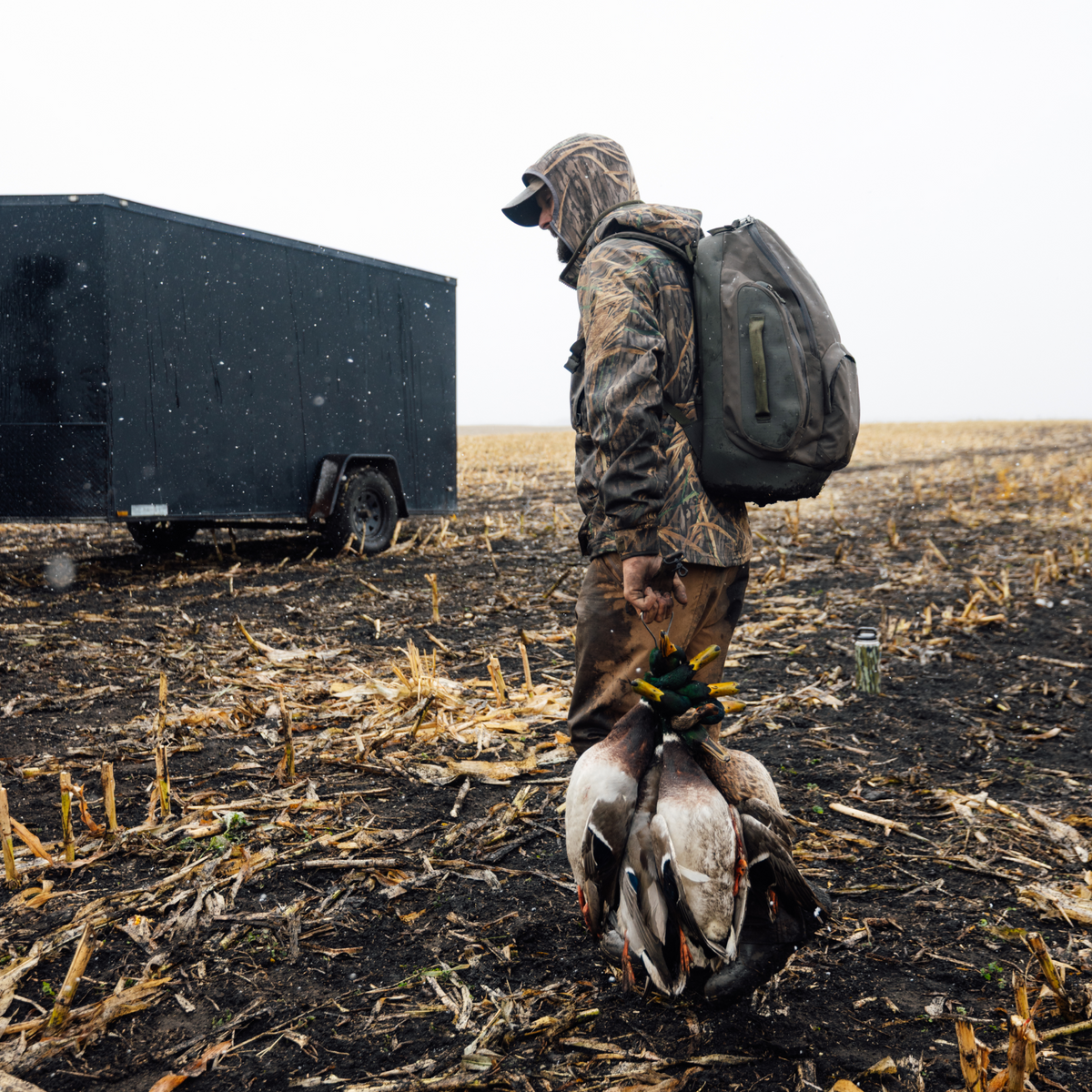 Hunter walking with the Chêne Gear Delta Pack in Cypress