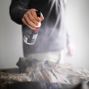 a person spraying a jacket