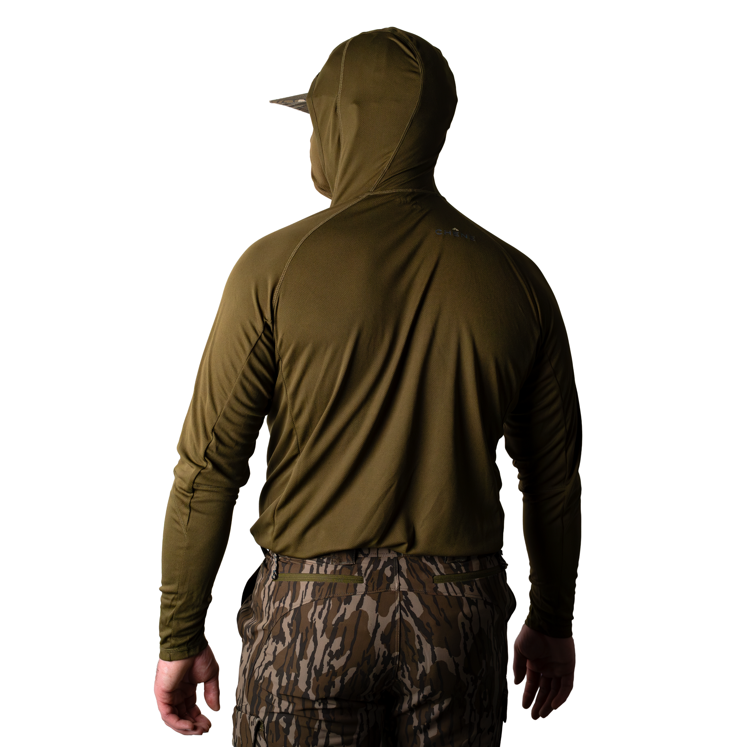 Model wearing a dark olive camouflage hoodie with built in face mask and brimmed cap, back body view on light background. dark_olive