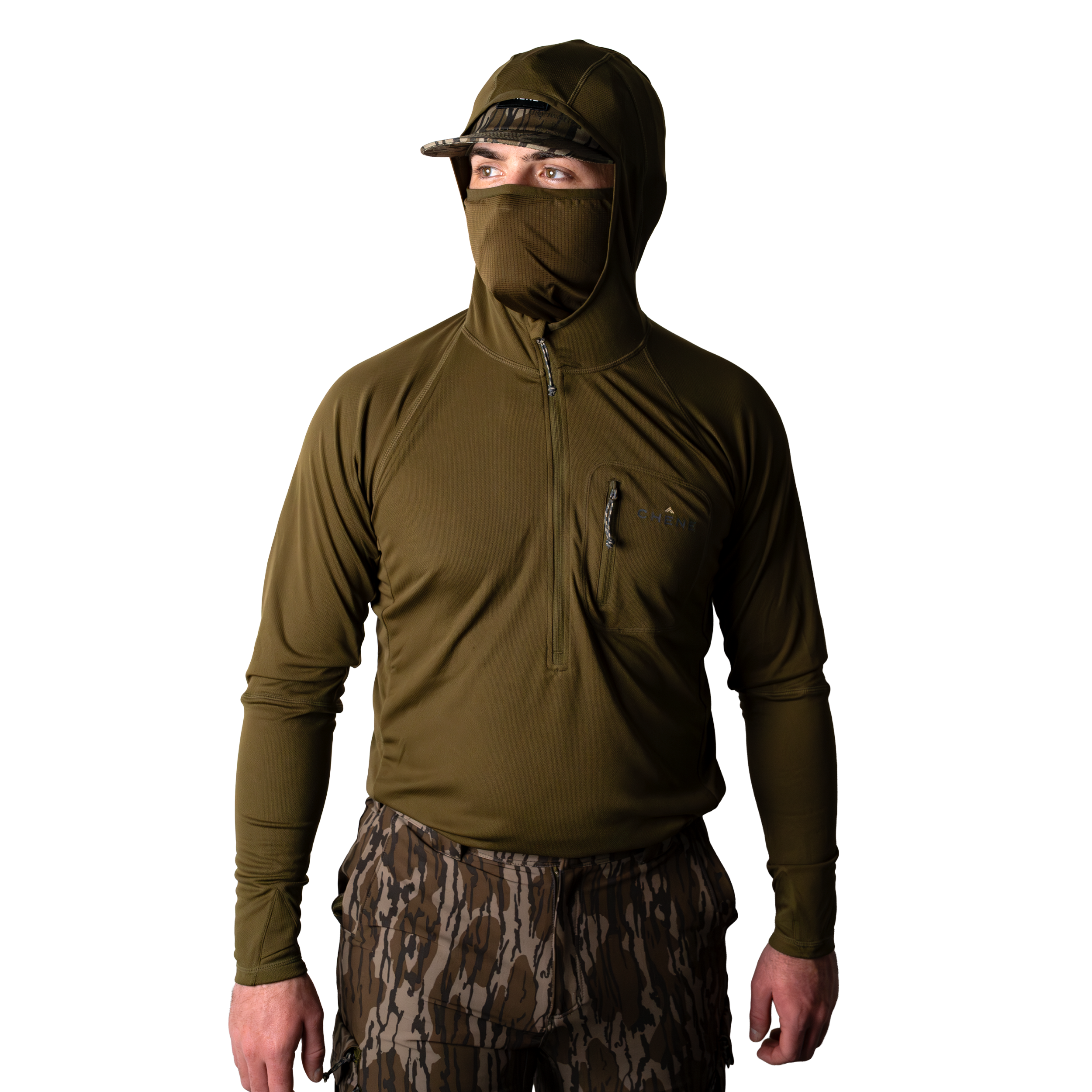 Model wearing a dark olive hoodie with built in face mask and brimmed cap, front view on light background. #dark_olive