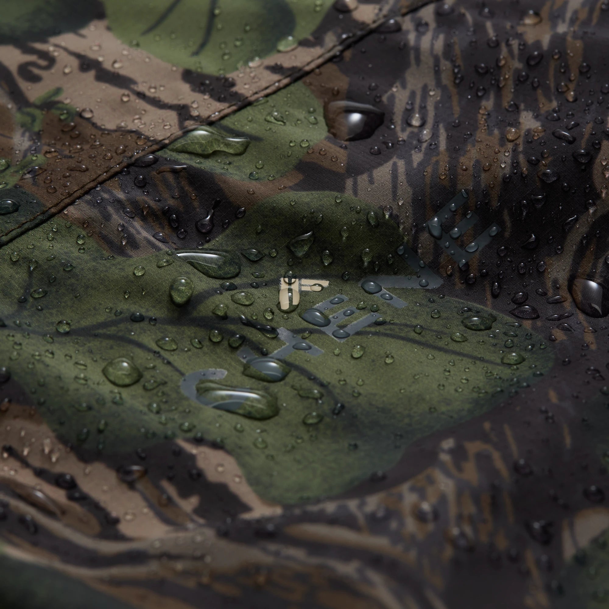 Hydro-Lok Velo Rain Jacket in Mossy Oak Full Foliage, fabric detail #mossy_oak_full_foliage