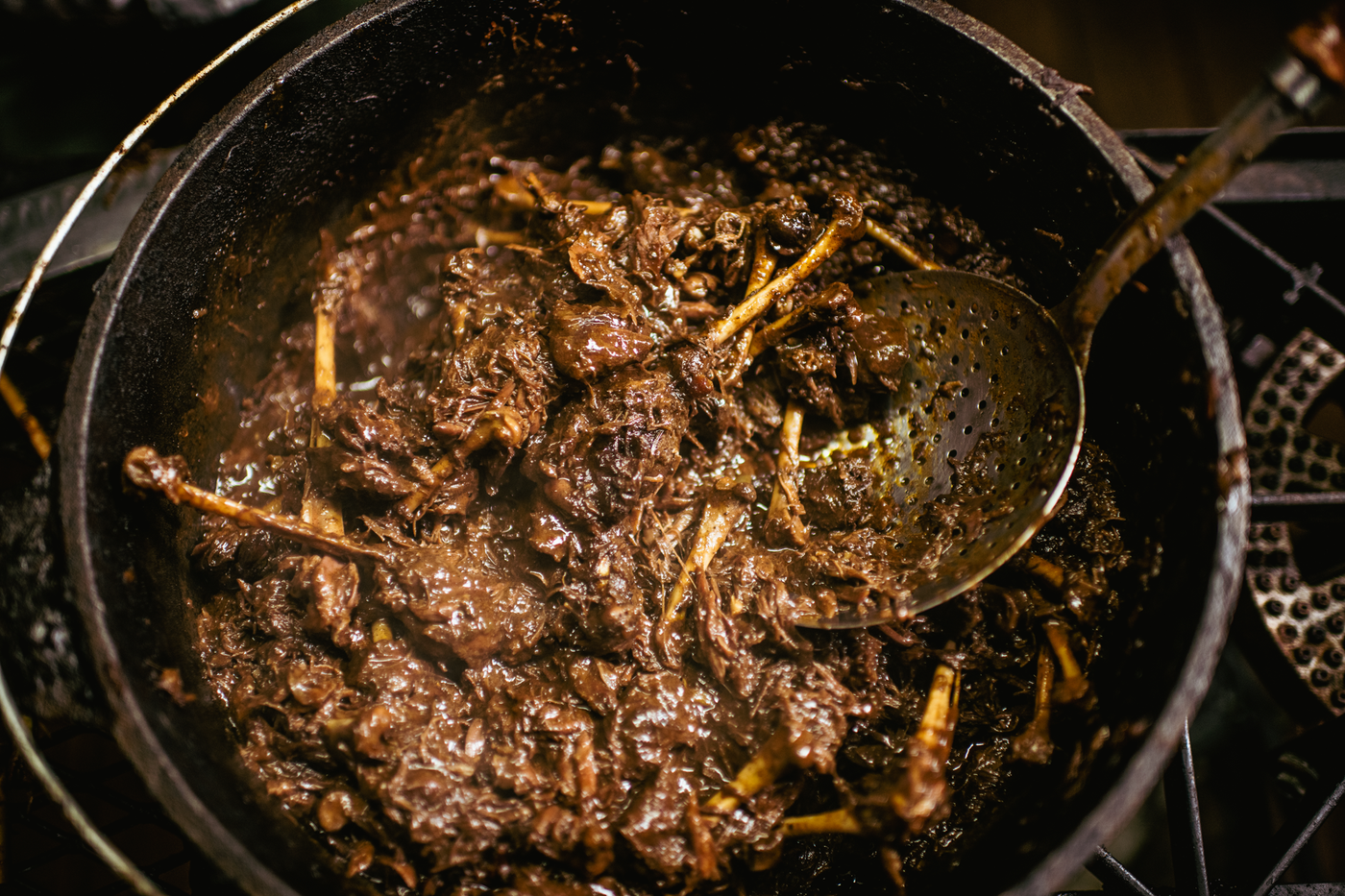 a pot of food with a ladle
